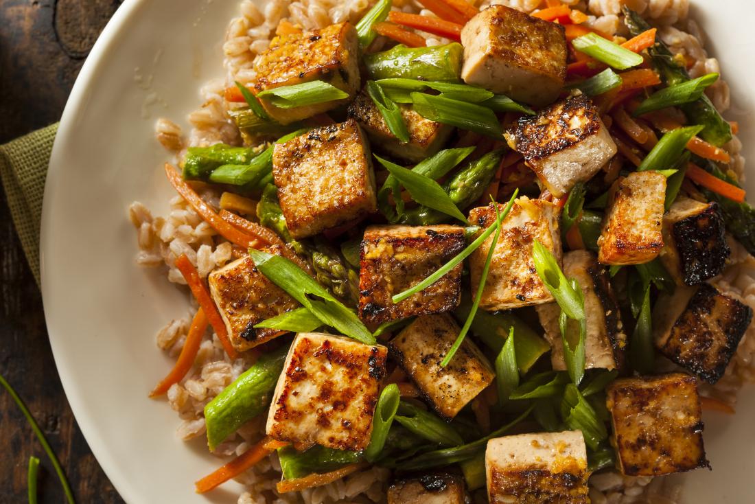 Tofu in bowl with rice.