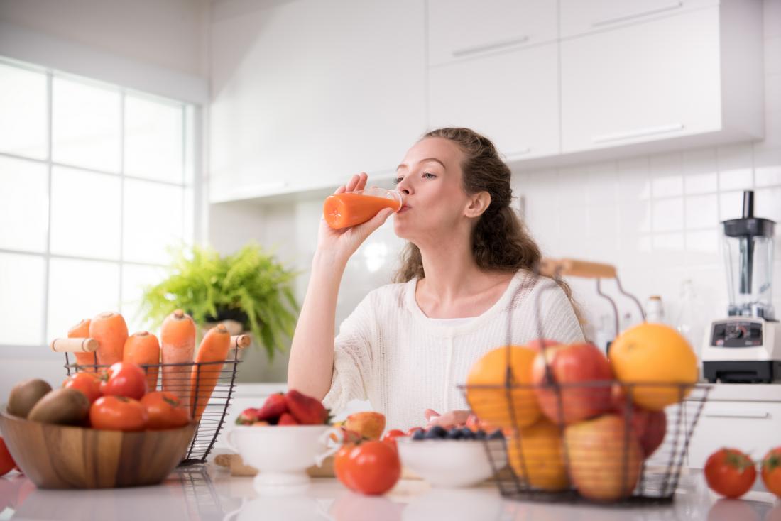 woman drinking fresh juice